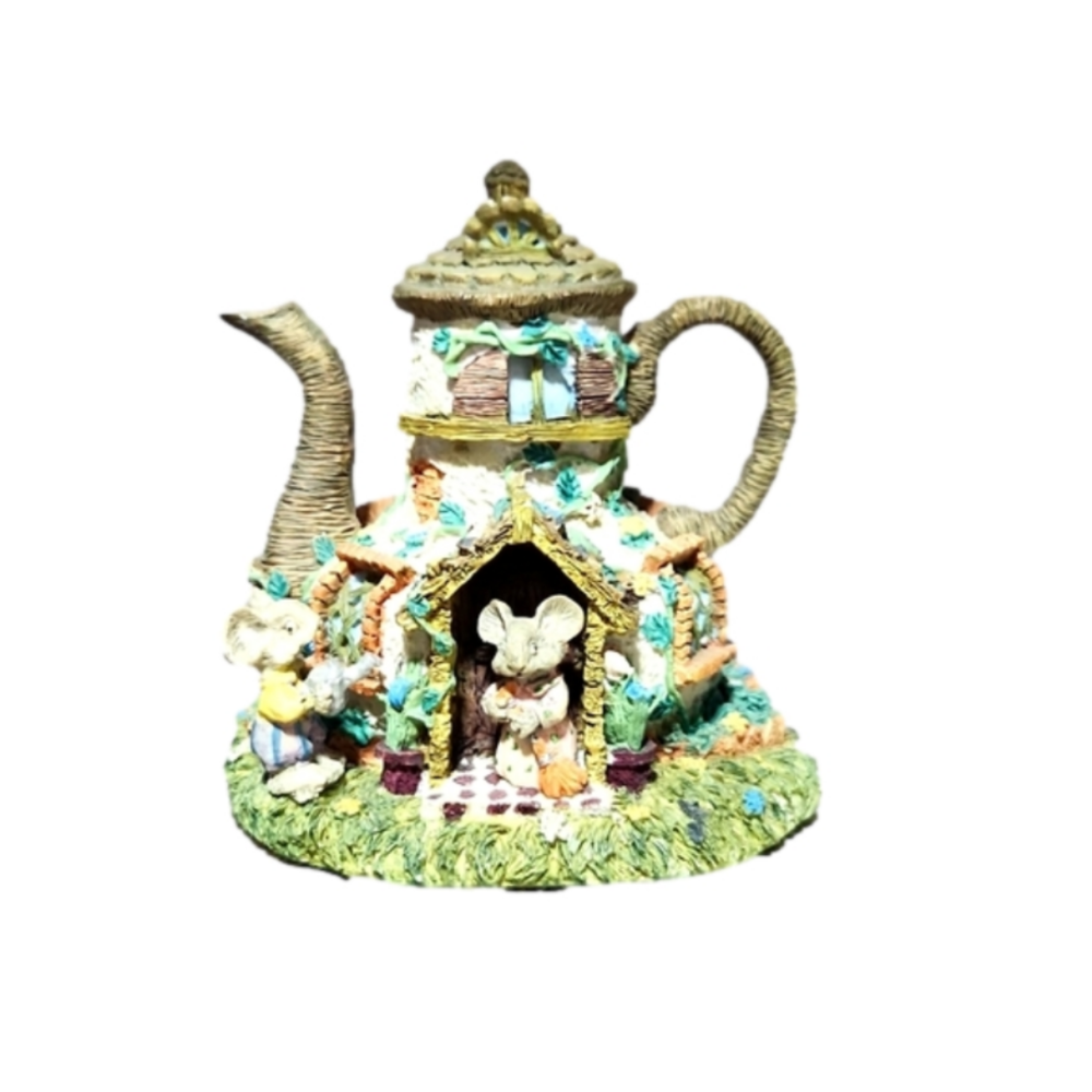 Mouse in a teapot house decoration